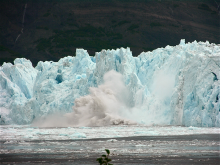 A calving event at Yahtse Glacier in Icy Bay, Alaska, sends a seismic wave through the ice. Seismologists are using these seismic signals to determine when and why calving occurs. Photo by Tim Bartholomaus.